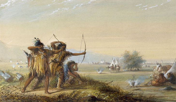 A group of native americans with bows and arrows
